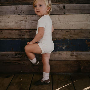 Ribbed oatmeal baby socks from angle 2, soft and stylish for little feet.