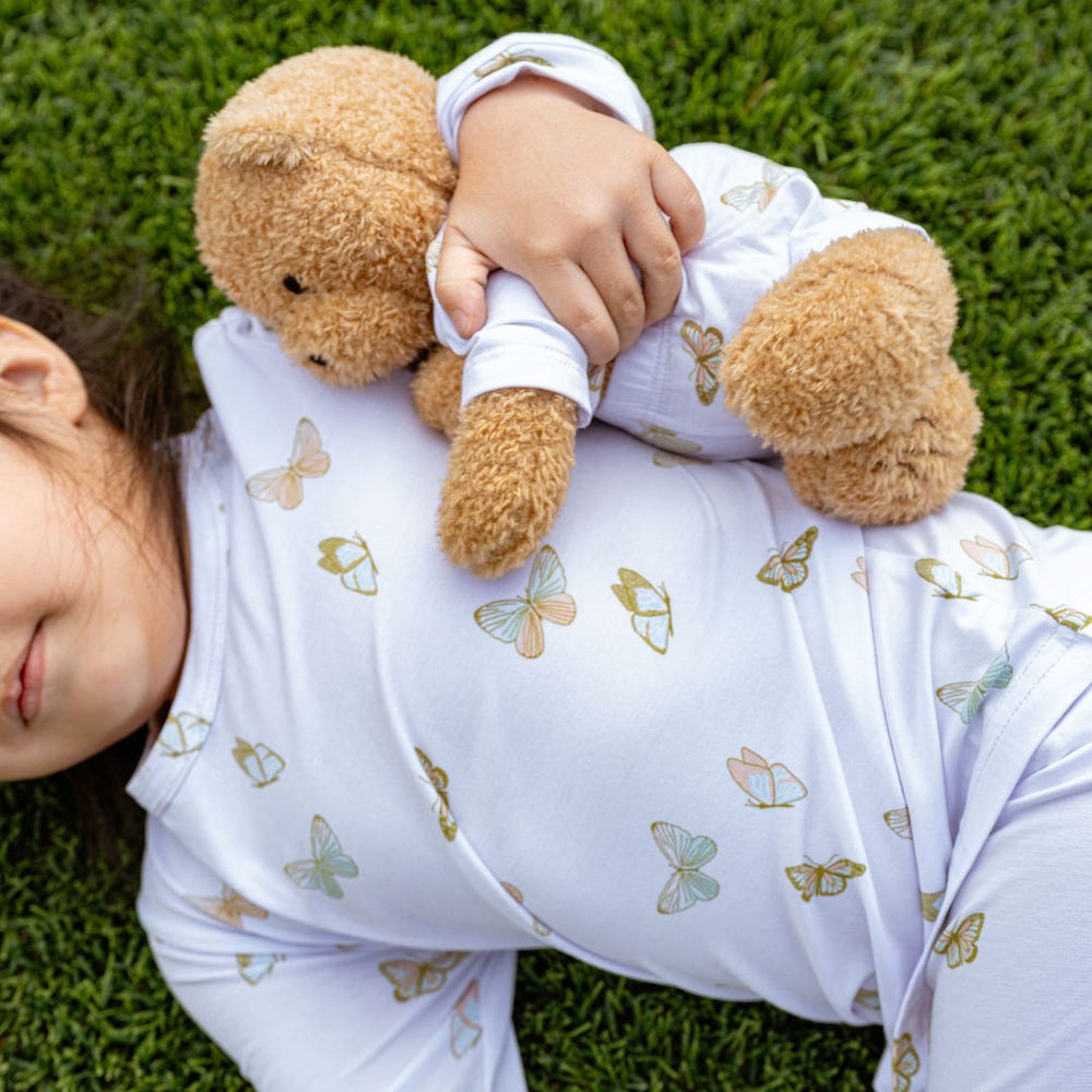 Soft teddy plush toy with butterfly design, perfect for baby bedding and sleep comfort.