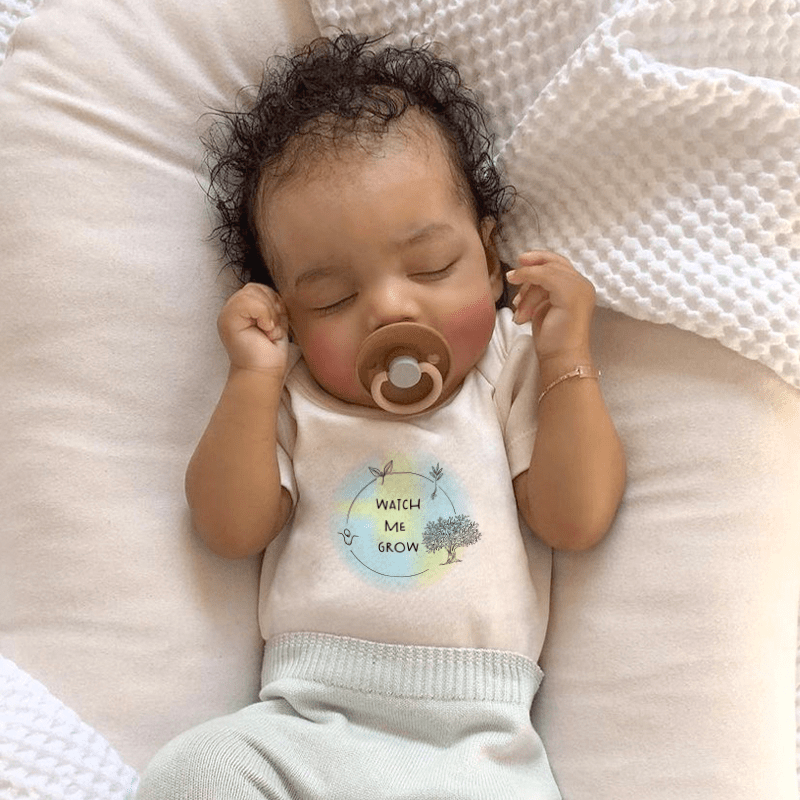 "Graphic short sleeve bodysuit for babies, featuring 'Watch Me Grow' design, perfect for playful outfits."
