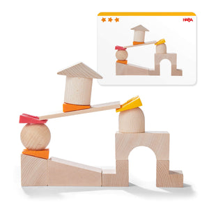 Teetering Towers Wooden Blocks in vibrant colors, showcasing a fun, educational stacking play for babies and toddlers.
