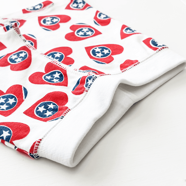 Tennessee Pajamas for babies, cozy and stylish, shown from angle 3. Perfect for comfy sleep and play.