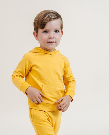 Cozy baby hoodie in vibrant canary yellow, perfect for comfort and style. Ideal for little ones!