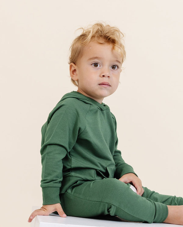 Cozy moss green hoodie for babies, perfect for warmth and style in any season.