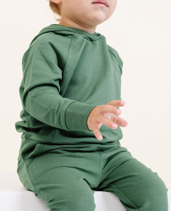 Coziest Hoodie in Moss for babies, soft and stylish, perfect for keeping little ones warm and comfortable.