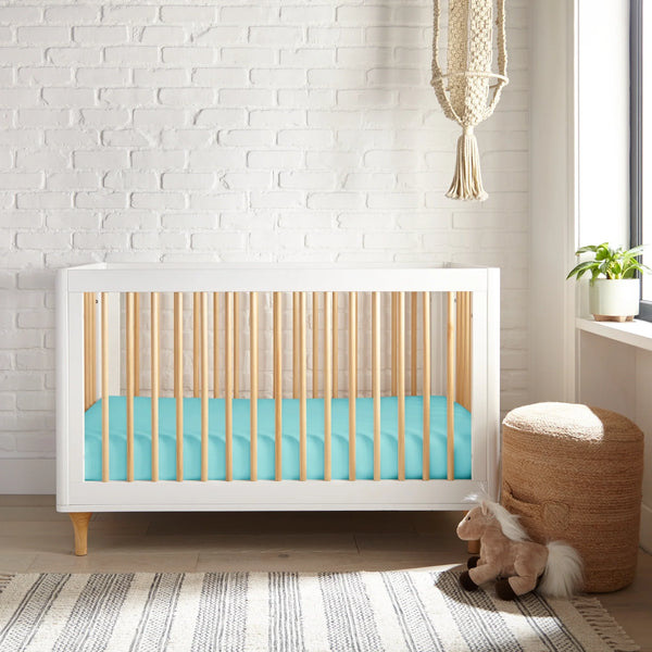 Cooling bamboo crib fitted sheet at a 27-degree angle, perfect for a comfortable baby's sleep.
