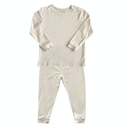Toddler pajama set in oat color, perfect for cozy sleep and play. Ideal clothing for little ones.