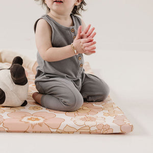 Blooms Vegan Leather Play Mat in angle view, perfect for stylish and safe baby playtime.