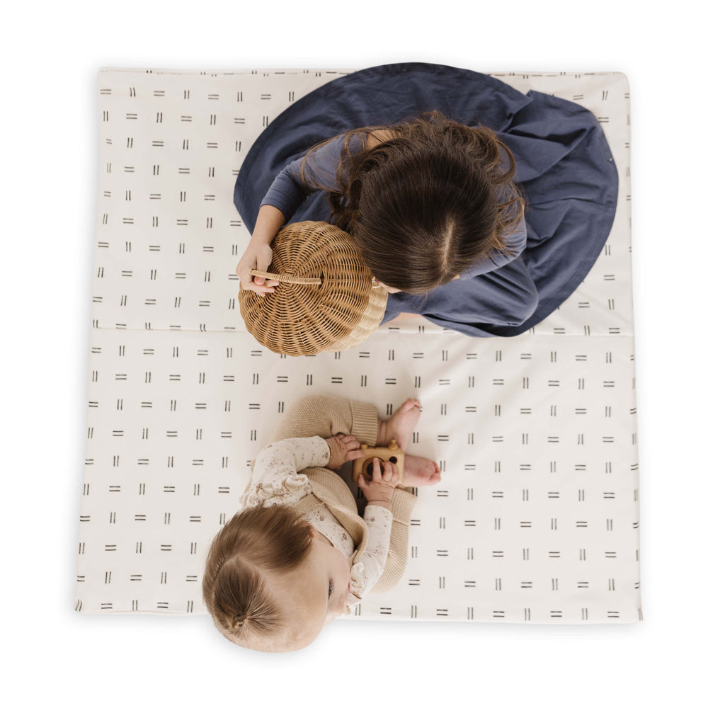 Mudcloth Vegan Leather Play Mat for babies, stylish and durable, perfect for playtime and tummy time activities.
