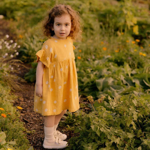 Clara Dress in Chamomile Sunshine Print, angle 4 view, perfect for baby girls' summer outfits.