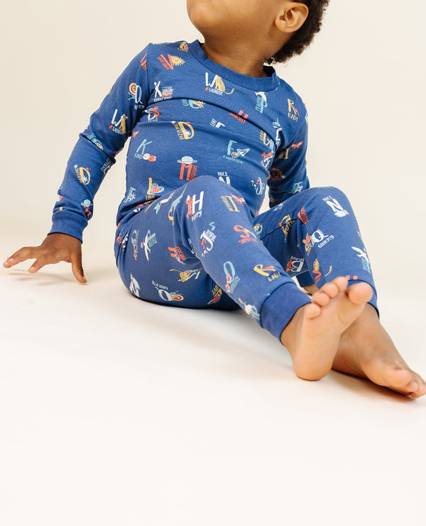 Ultimate Pajama Set in Good Vibes ABC Navy for babies, showcasing cozy design and playful print from angle 4.