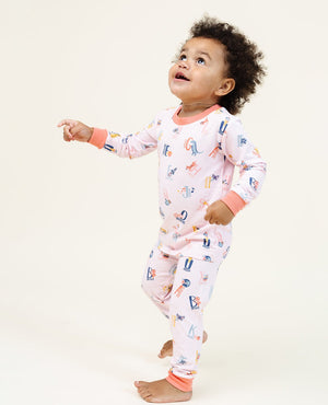 Ultimate Pajama Set in Good Vibes ABC Pink for babies, featuring soft fabric and playful design. Perfect for cozy nights!