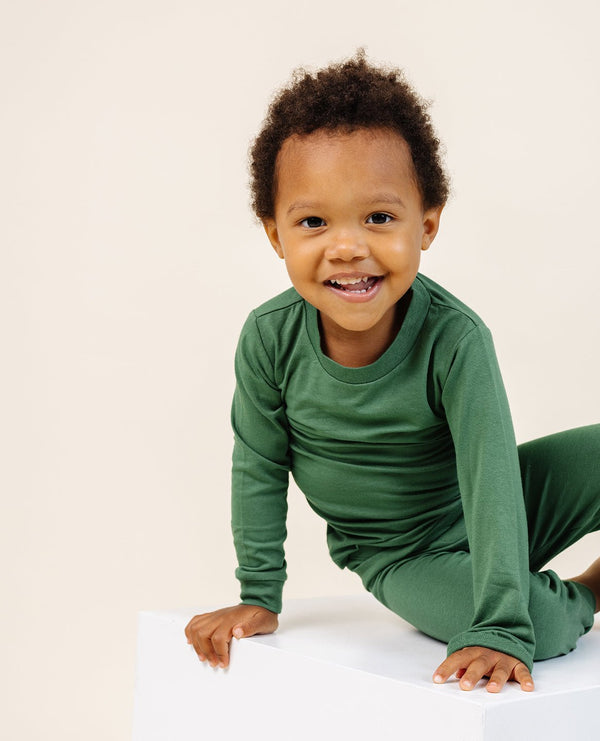 Ultimate Pajama Set in Moss for babies, featuring soft fabric and cozy design for comfortable sleep.