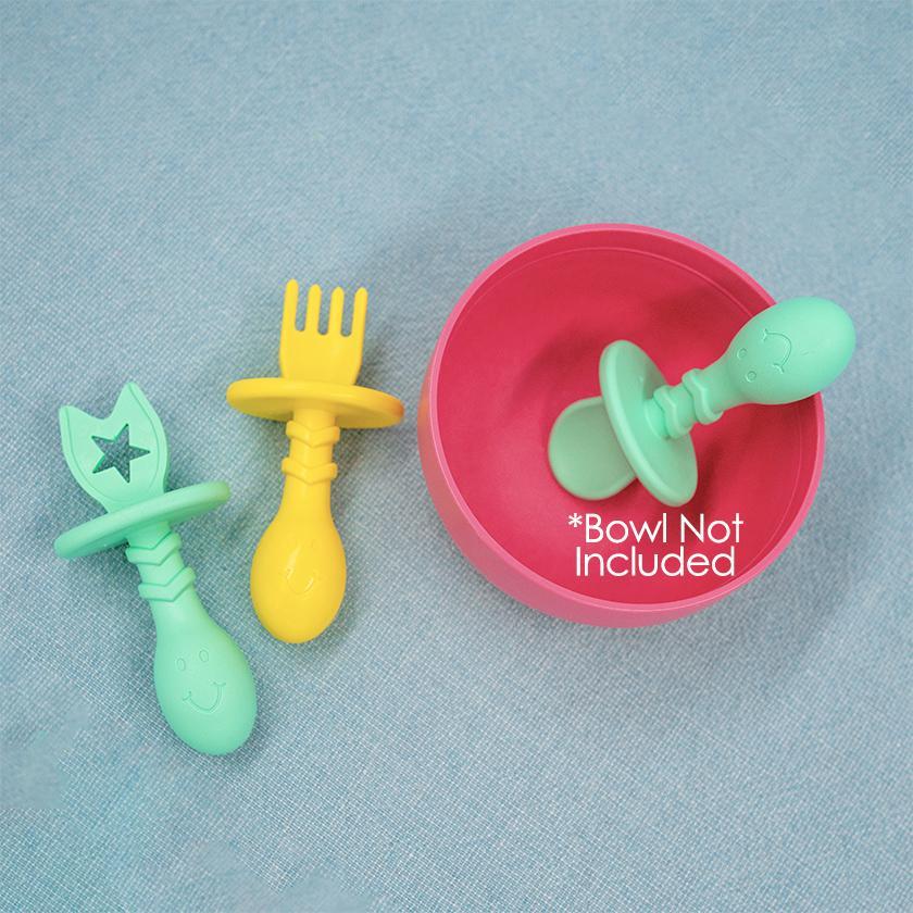 "Eggware 3-piece set of baby feeding utensils and teethers in vibrant colors for safe and fun mealtime."