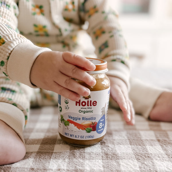 Holle Organic Baby Food Jar Veggie Risotto - 12 jars, angle view showcasing healthy baby meal options.