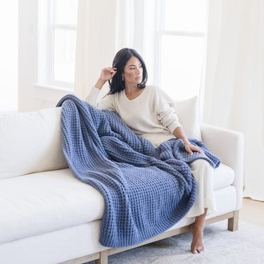 Soft waffle knit throw blanket for babies, perfect for cozy swaddling and comfort. Ideal for nurseries and playtime.