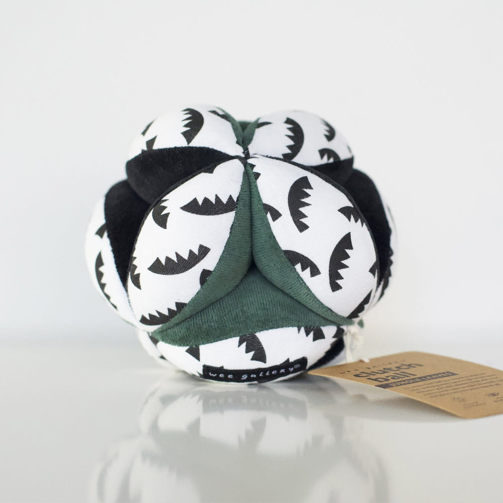 Colorful Clutch Ball - Jungle Leaves design for babies, promoting sensory play and motor skills development.