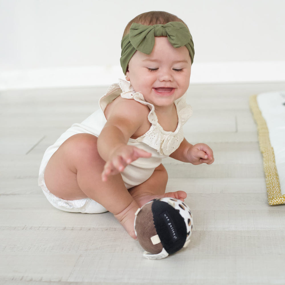 Acorn Clutch and Taggy Ball Bundle - colorful baby toys for sensory play and development.