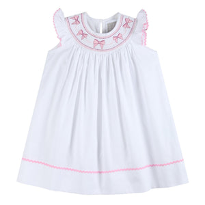 White and pink bows smocked bishop dress for baby girls, perfect for special occasions.