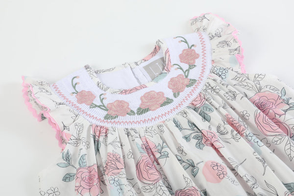 White and pink floral smocked bishop dress for babies, showcasing a charming design from angle 3.