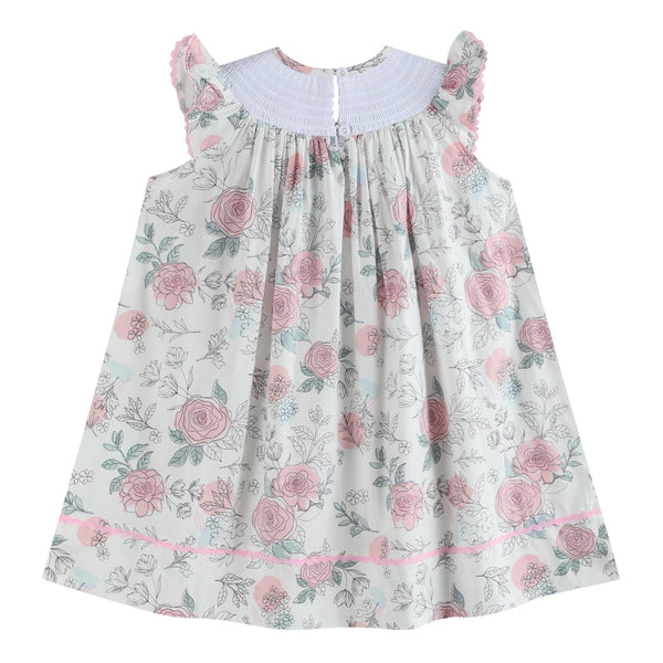 White and pink floral smocked bishop dress for babies, showcasing a charming design from angle 4.
