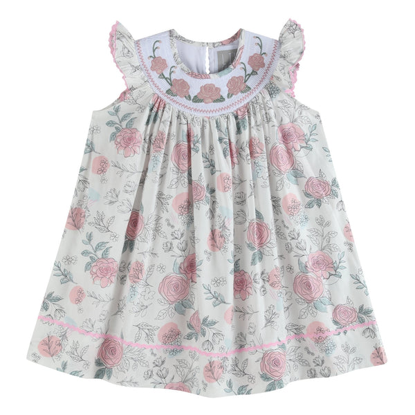 White and pink floral smocked bishop dress for babies, perfect for special occasions and everyday wear.