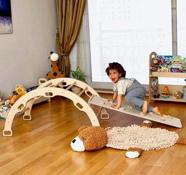Wooden climbing arch rocker with ramps for babies, promoting active play and motor skills development.