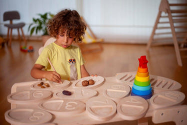 Wooden tracing board for toddlers, a Montessori toy promoting fine motor skills and creativity.