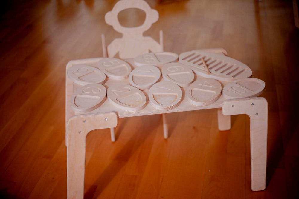 Wooden tracing board for toddlers, a Montessori toy promoting fine motor skills and creativity.