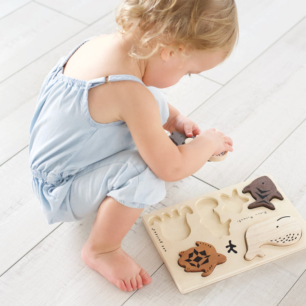 Wooden tray puzzle featuring colorful ocean animals, perfect for toddlers and early learning play.