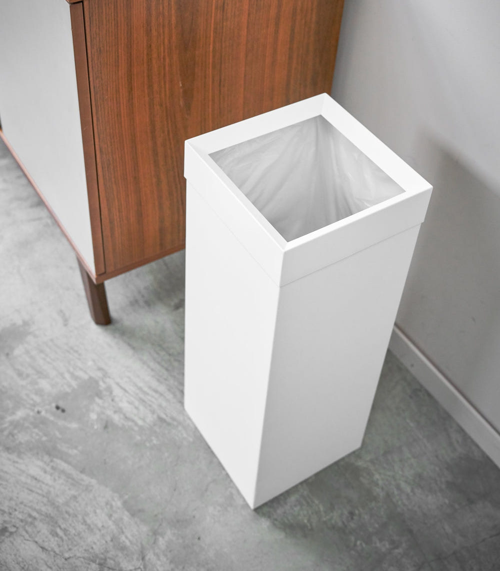 Stylish steel trash can for baby rooms, perfect for discreet waste disposal.
