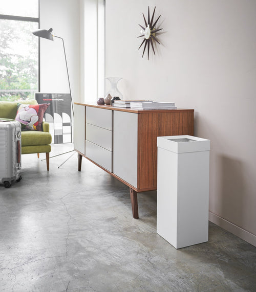Stylish steel trash can for baby rooms, perfect for discreet waste disposal.