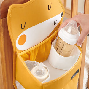 Cozy Buddy Crib Organizer in angle view, perfect for keeping baby essentials tidy and accessible in the nursery.